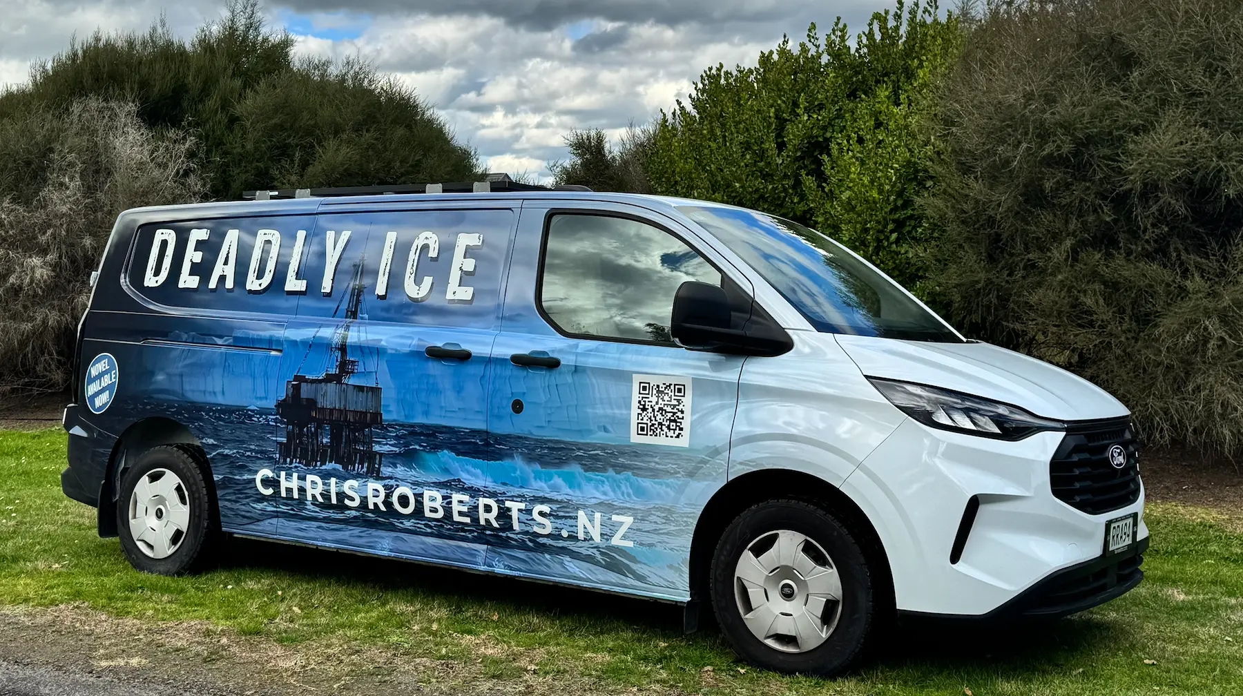 Side view of the signwritten Ford van wrapped with the Deadly Ice artwork — oil rig, iceberg and Southern Ocean scene
